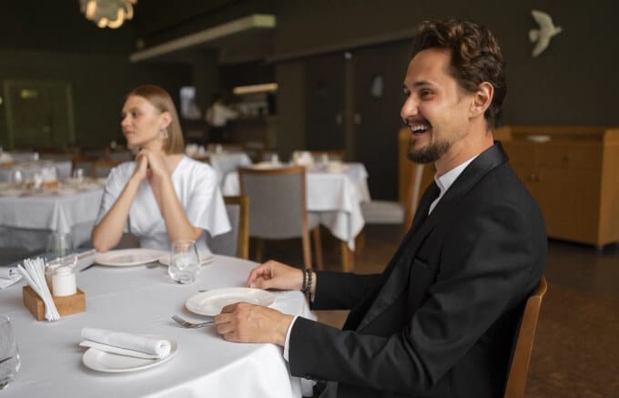 A couple enjoying a meal at a restaurant.