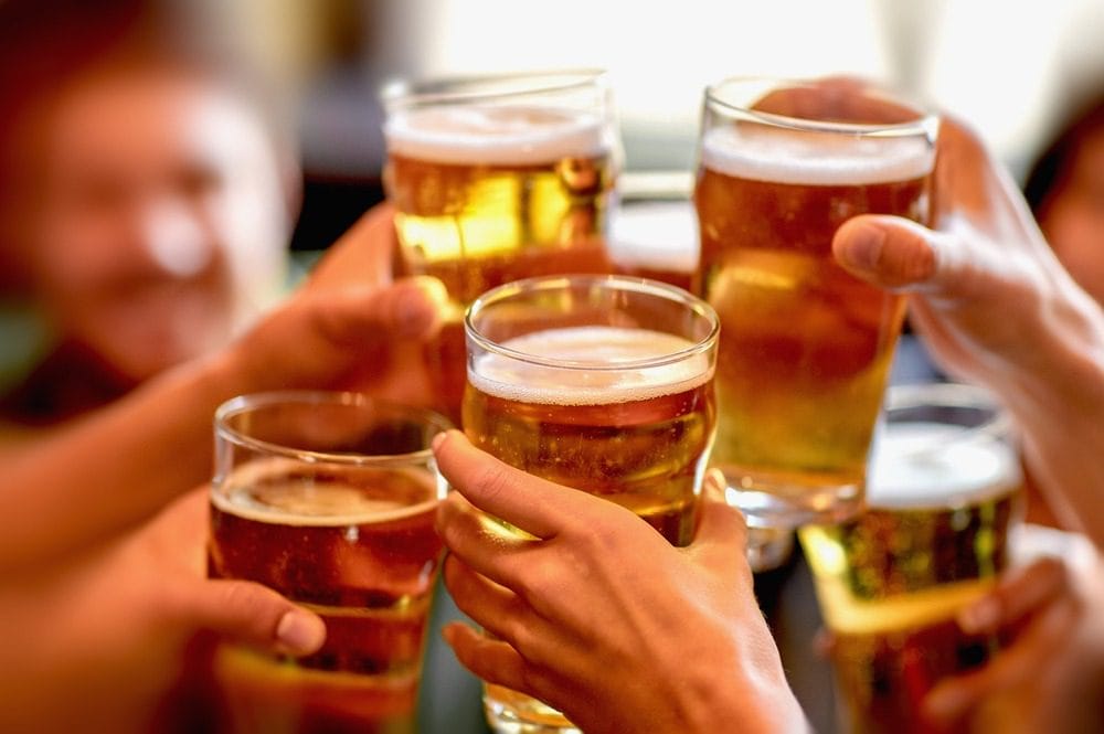 Leisure,,Drinks,,Celebration,,People,And,Holidays,Concept,-,Smiling,Friends Fantastic Breweries in Traverse City 1